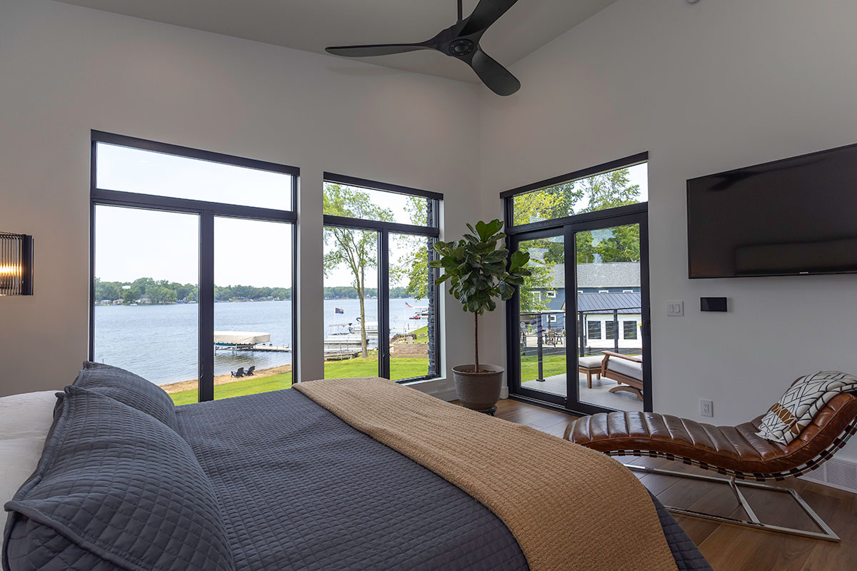 photo of modern lake house primary bedrooms